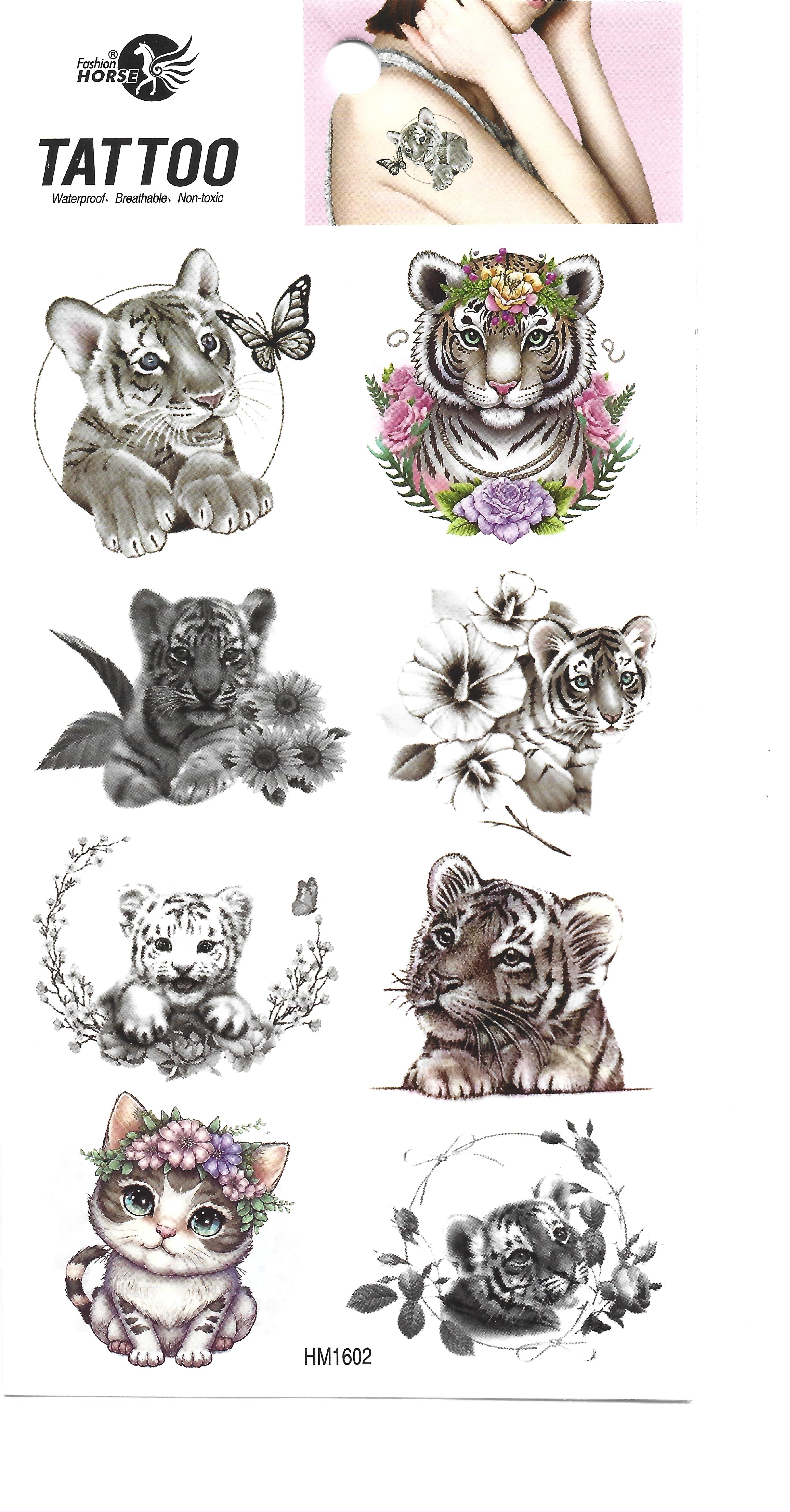 Hoja completa de tatuajes temporales con varios diseños adorables de cachorros de tigre y un gatito, algunos con flores, con un pequeño ejemplo en el hombro de una persona.